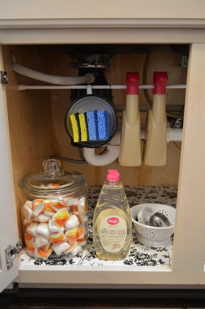 tension rod organization under kitchen sink